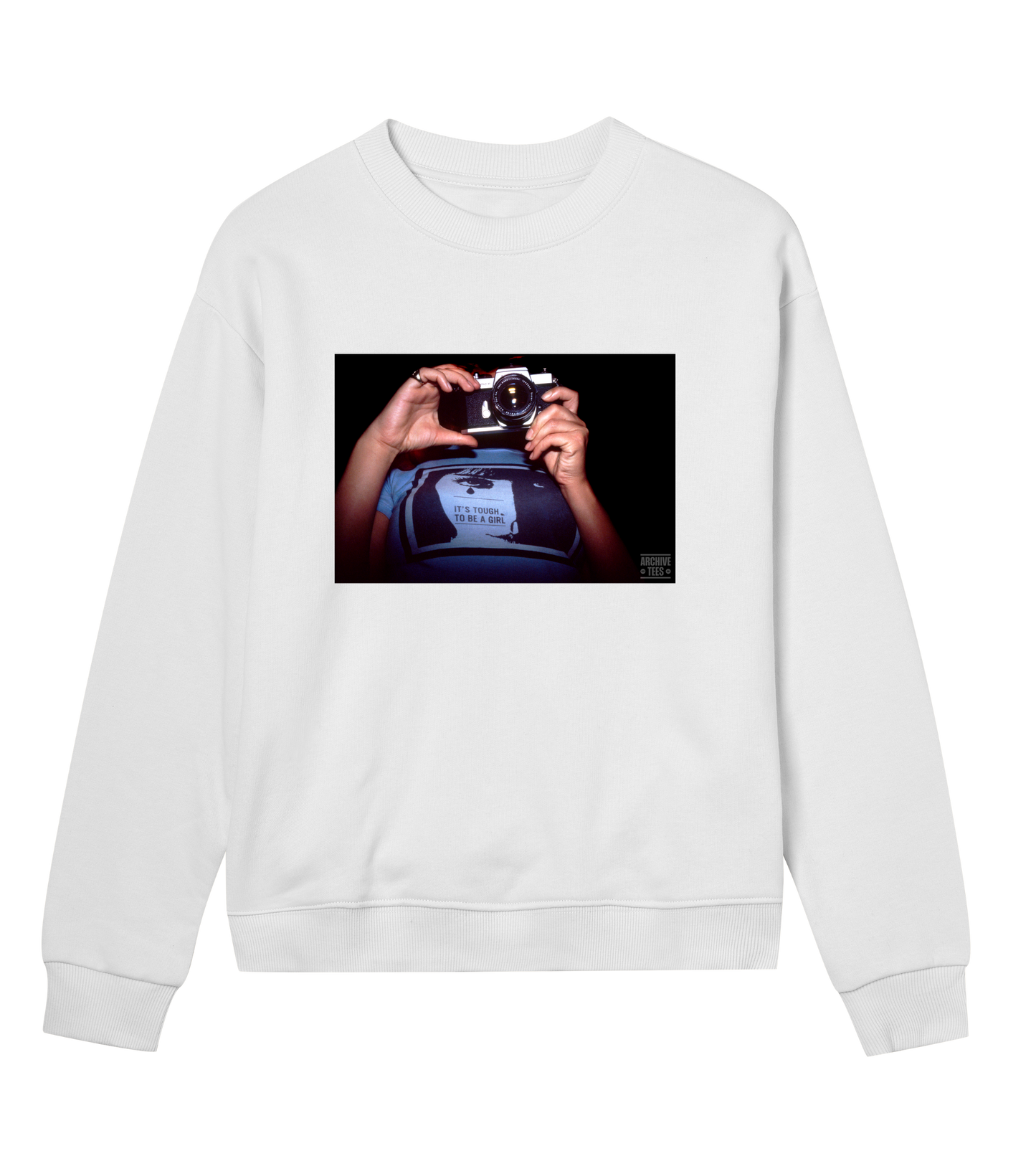 Archive Tees women's sweatshirt in white with vintage photograph from 1998 of woman holding a camera wearing a shirt with the words, it’s tough to be a girl. Vintage women's sweatshirt by Archive Tees. Sold by Archive Tees shop.