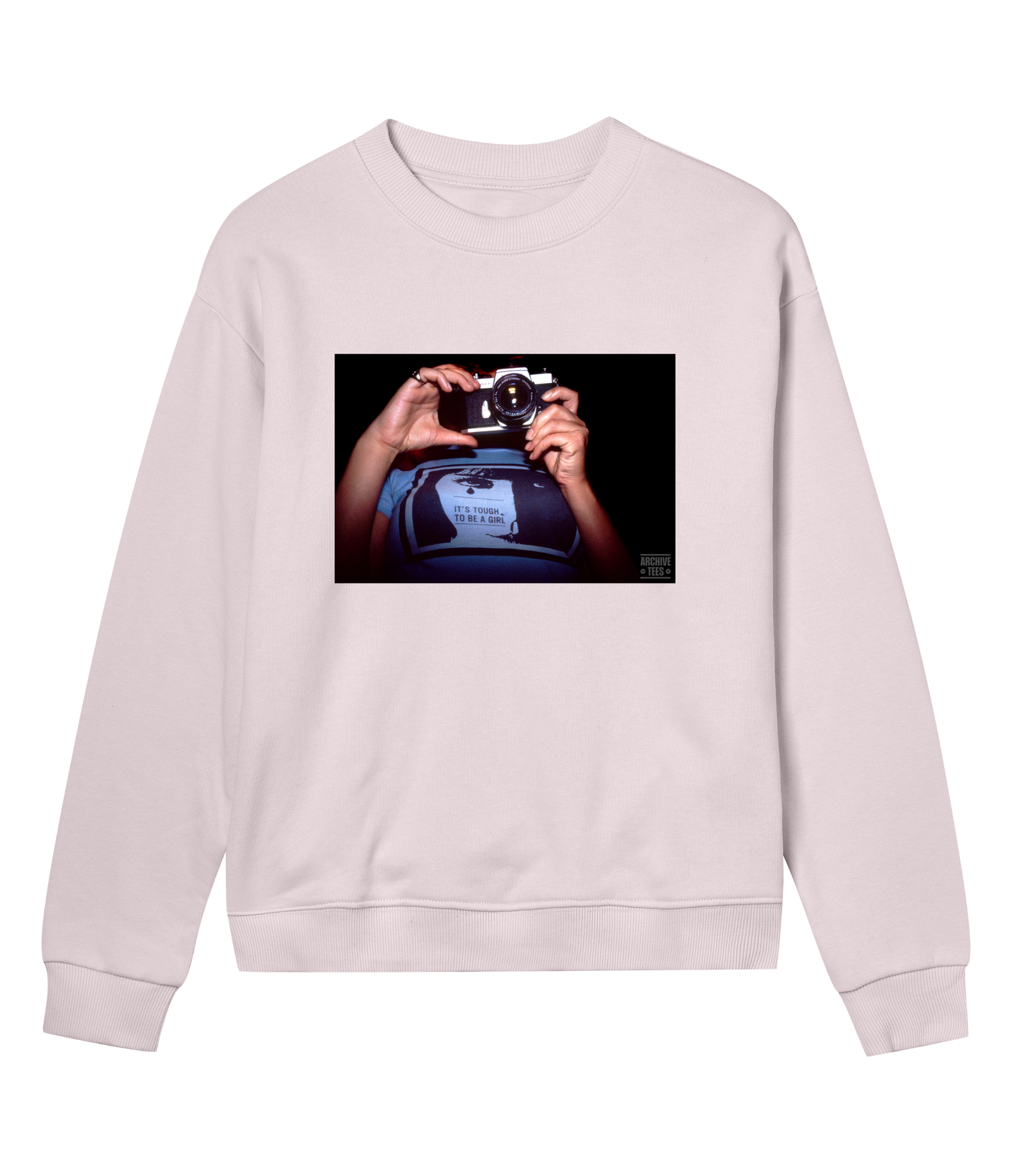 Archive Tees women's sweatshirt in pink with vintage photograph from 1998 of woman holding a camera wearing a shirt with the words, it’s tough to be a girl. Vintage women's sweatshirt by Archive Tees. Sold by Archive Tees shop.