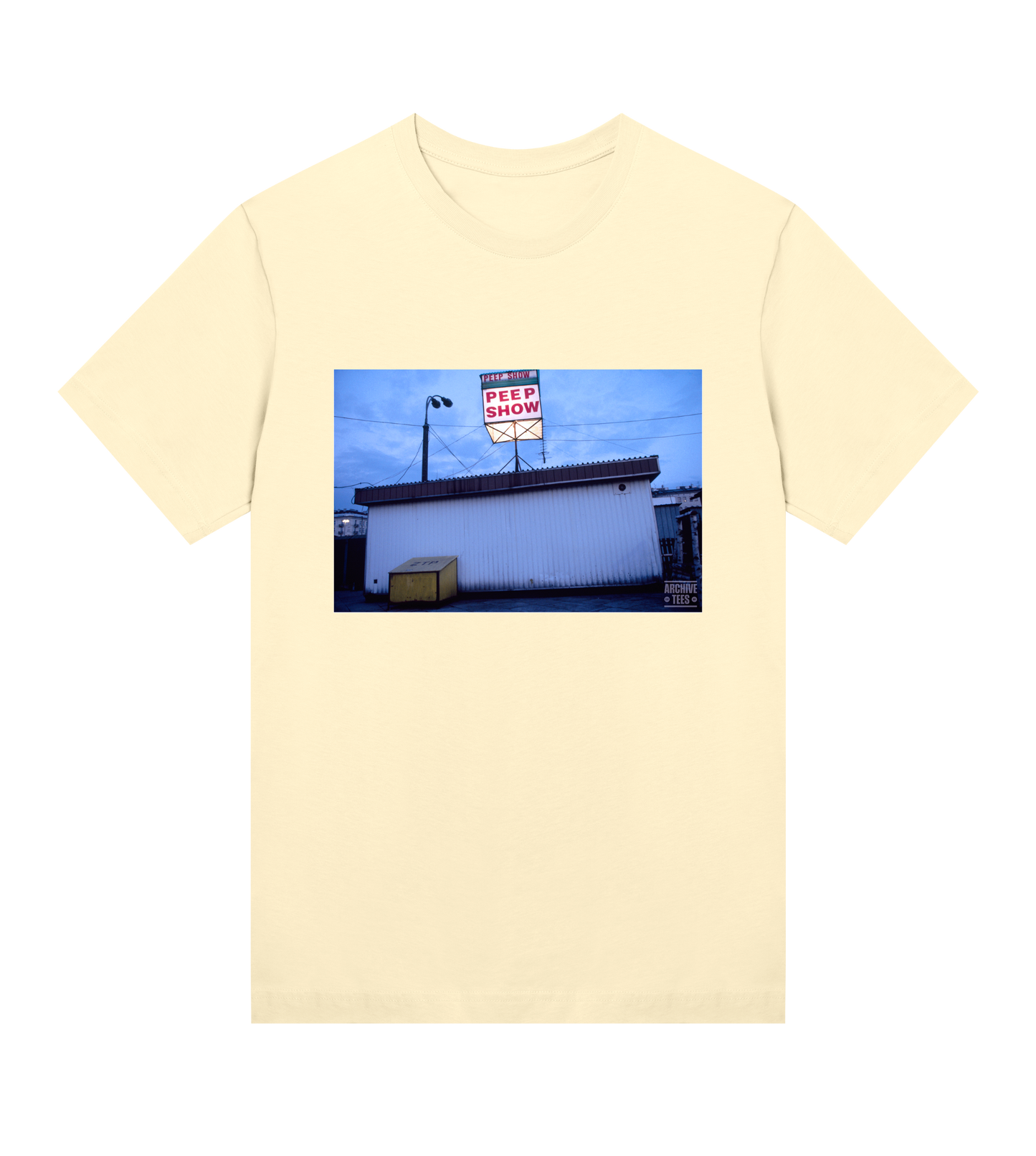 Archive Tees women's T-shirt in yellow 
with vintage photograph of Peep Show shed in Warsaw, Poland in 1998. Vintage clubbing T-shirt by Archive Tees. Sold by Archive Tees shop.